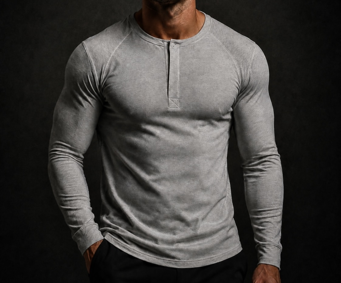 Man wearing the NORE Henley in heather gray, tapered long-sleeve henley, front view