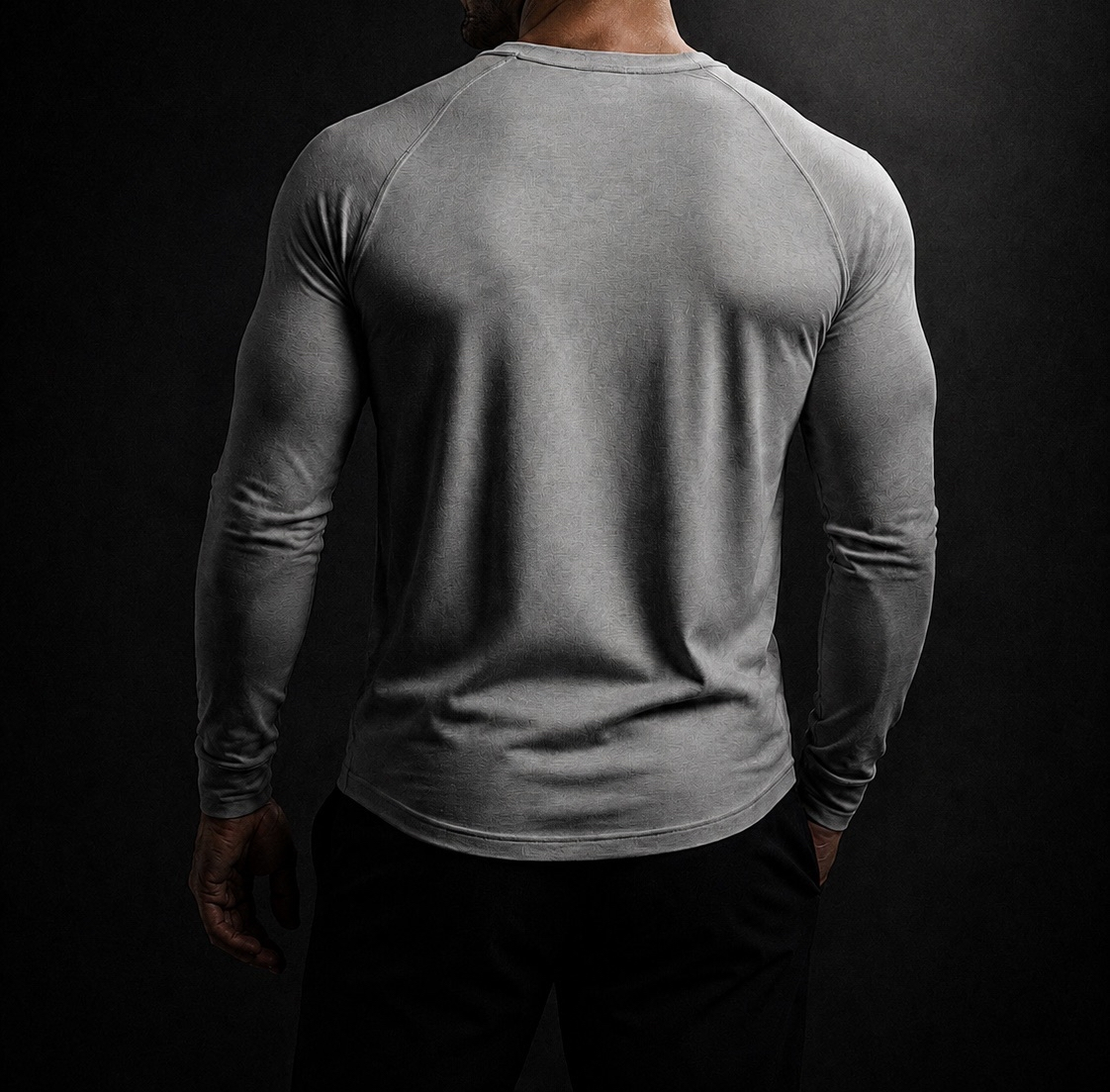Back view of the gray NORE Henley showing the dropped hem