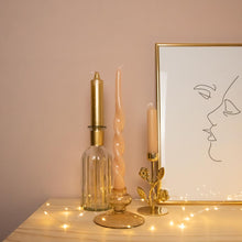 Load image into Gallery viewer, Dinner Candles XL Lyne Gold and Glass Candle Holder Lone Blush with Candle Holder Flora Brass holding Dinner Candle Millie Cream
